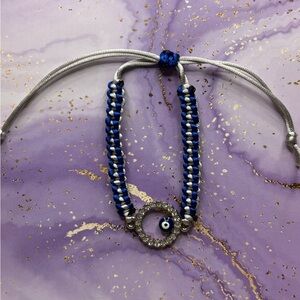 Handmade nylon satin adjustable bracelet with evil eye charm